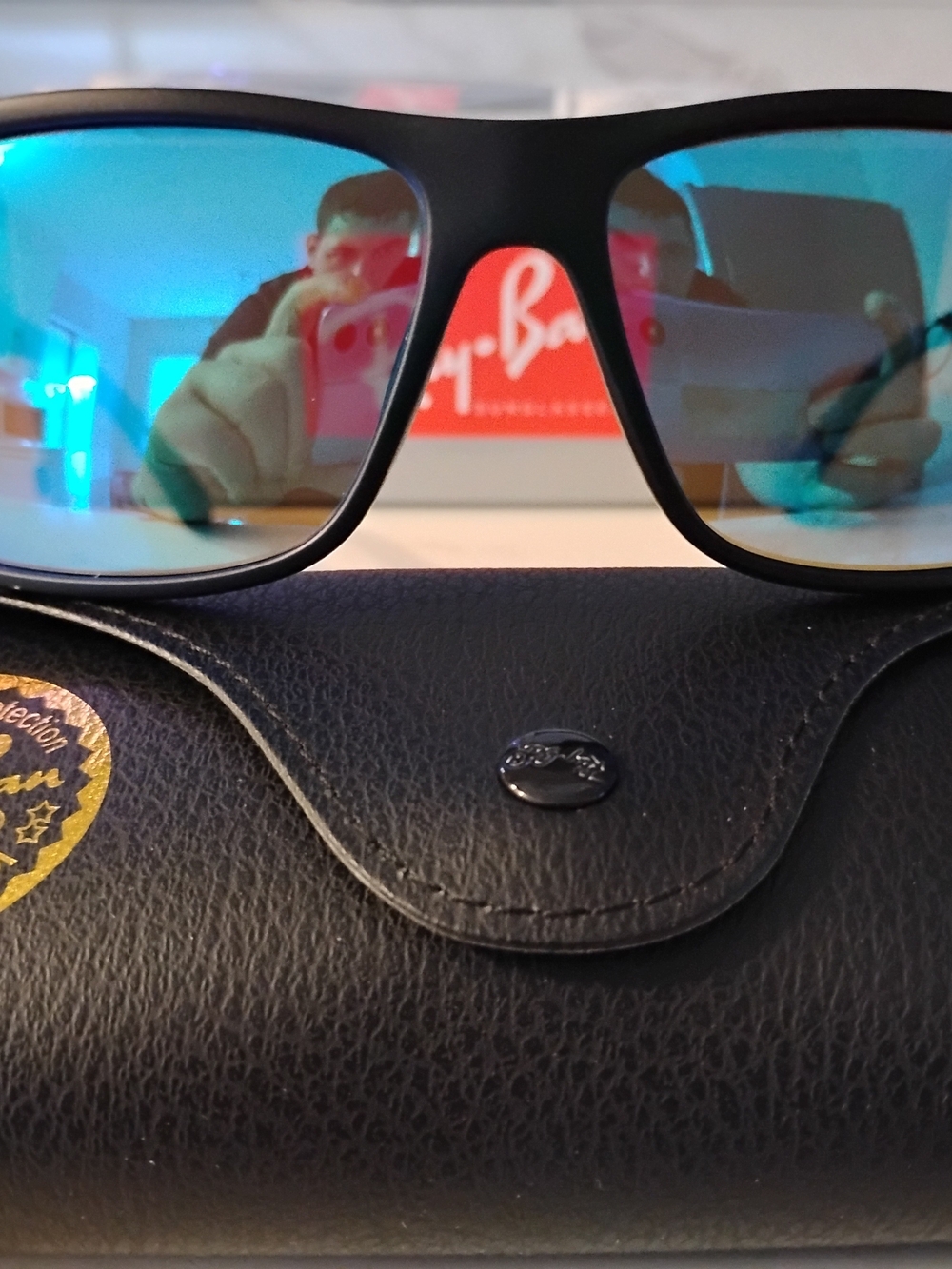 Ray-Ban Men's Black Frame Sunglasses with Blue Mirrored Lenses
